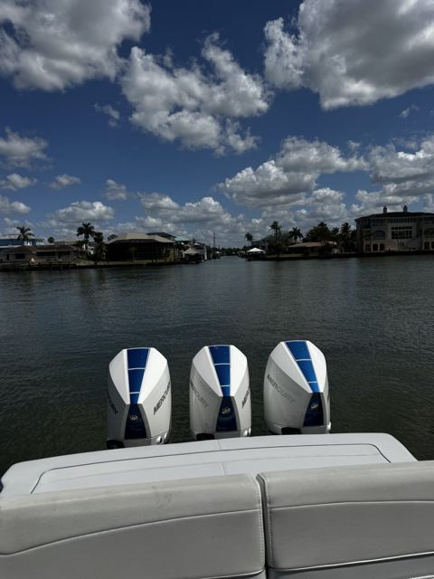 Triple outboards on the water